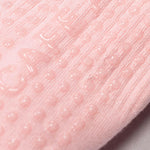 Load image into Gallery viewer, Close-up of pink textured grip socks