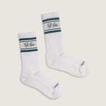 Load image into Gallery viewer, Pair of white socks with green accents and 'Cafe Apres' branding on a beige background