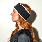 Load image into Gallery viewer, Person wearing a black and white headband against a plain background