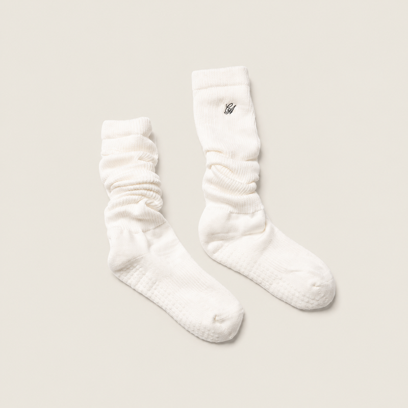 The Comfiest Cloud Sock with Grip — a plush scrunch-silhouette studio sock with a cushioned sole and grip bottom