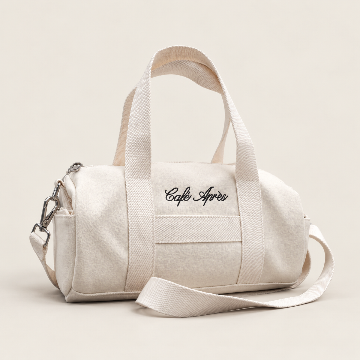 The Helaine Mini Canvas Duffle Bag — a compact Café Après cotton canvas duffle 