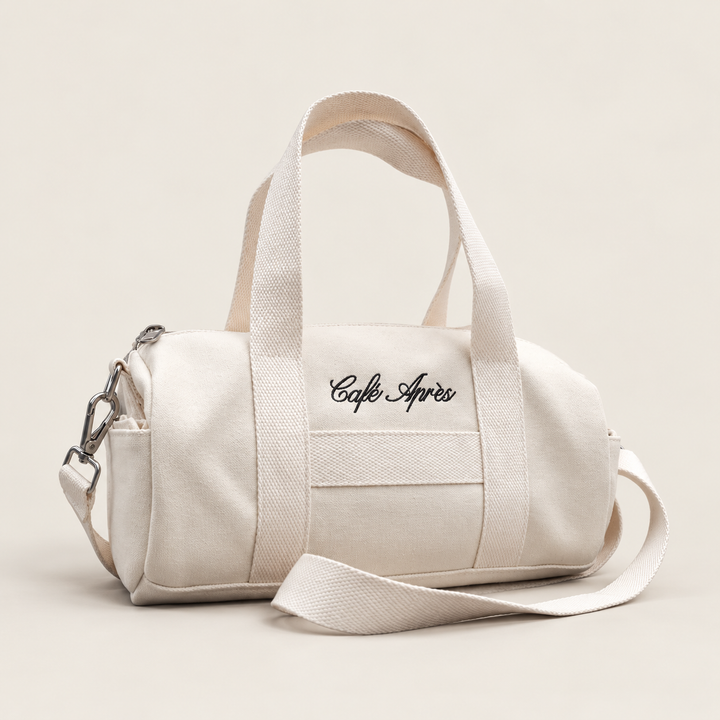 The Helaine Mini Canvas Duffle Bag — a compact Café Après cotton canvas duffle 
