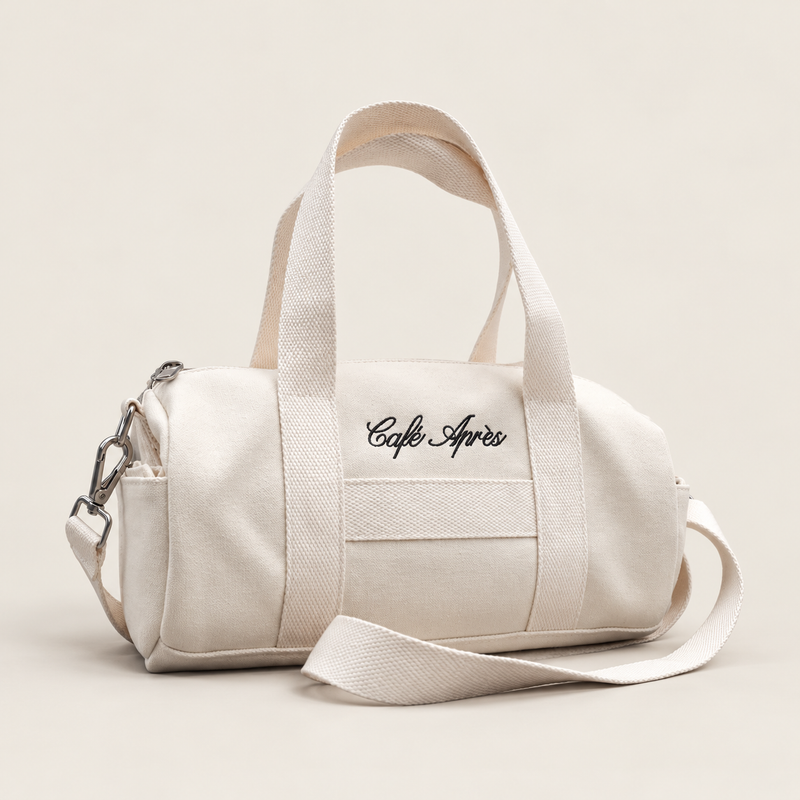 The Helaine Mini Canvas Duffle Bag — a compact Café Après cotton canvas duffle 