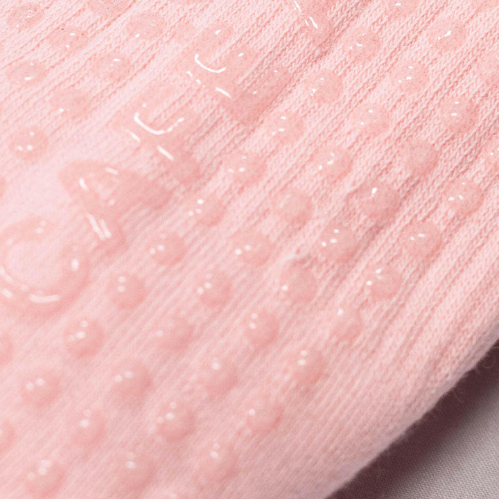 Close-up of pink textured grip socks