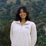 Person standing in front of the Hollywood sign